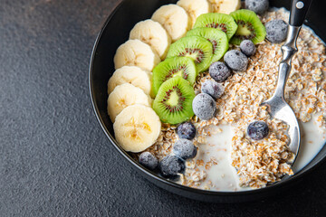 oatmeal berries oat flakes breakfast porridge healthy meal food diet snack on the table copy space food background rustic. top view keto or paleo diet veggie vegan or vegetarian food