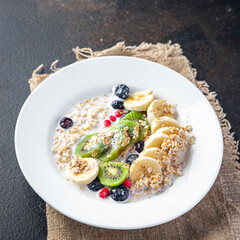 oatmeal berries oat flakes breakfast porridge healthy meal food diet snack on the table copy space food background rustic. top view keto or paleo diet veggie vegan or vegetarian food