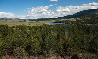A photo of the mountain road taken from a gondola. Top view of mountain road.