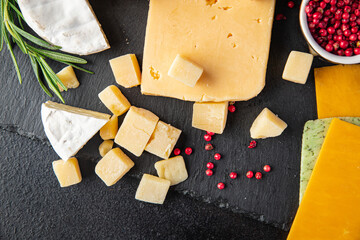 cheese plate assorted types of cheese brie, camembert, parmesan, cheddar and others healthy meal food diet snack on the table copy space food background rustic. top view
