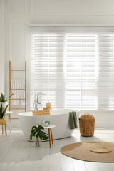 Stylish bathroom interior with green plants. Home design