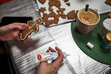 icing gingerbread cookies in the kitchen