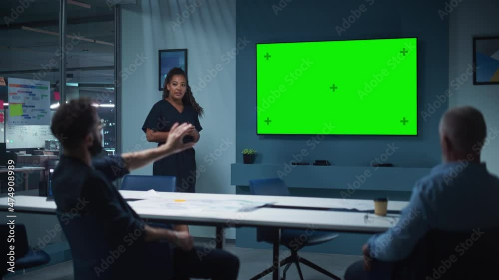 Poster company operations manager holds meeting presentation for a team of executives. multiethnic female u