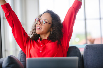 African American business freelance woman working at home with online communication using laptop
