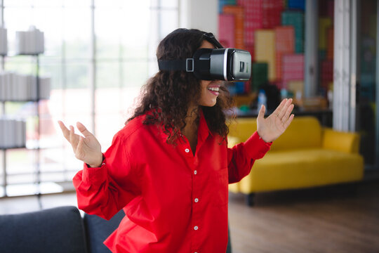 African American woman business person with virtual goggles headset VR device digital technology