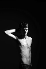Skinny young man posing fashion, anorexic look, slim body. - obrazy, fototapety, plakaty