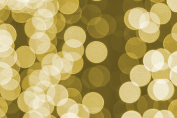 Colorful defocused bokeh lights in blur night background. Abstract gold circular bokeh background.