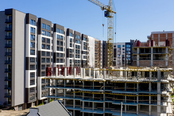 Aerial view of high residential apartment building under construction. Real estate development
