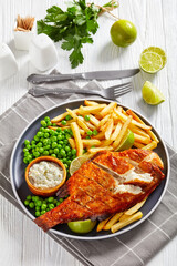 fried redfish with chips, green peas, tartar sauce