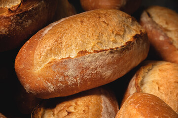 Fresh hot appetizing bread after baking in the oven. Close-up healthy and tasty food