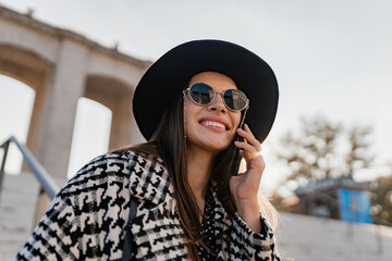 attractive young woman walking in autumn wearing coat