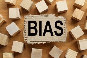 BIAS. text on torn paper from under the box - obrazy, fototapety, plakaty