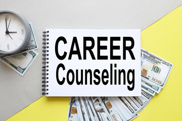 Career Counseling. text on notepad on yellow background. notepad near money