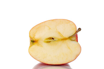 One half of an organic red apple, close-up, isolated on white.