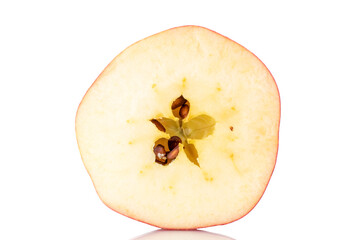 One half of an organic red apple, close-up, isolated on white.