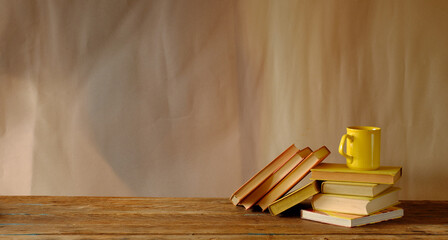 stack of books, cup of coffee, panorama, good copy space