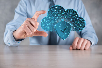 Cloud technology. Polygonal wireframe cloud storage sign with shield with a tick on dark blue....