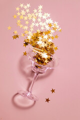 holiday glass on a pink background