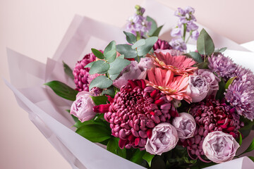 Beautiful bouquet of mixed flowers on color background. creative flowers and floristic design ideas. closeup