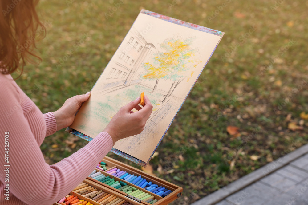 Canvas Prints Woman drawing with soft pastels outdoors, closeup