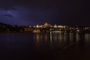 Fototapeta na wymiar Night view of Prague Castle and Charles Bridge during a rainstorm - Prague, Czech Republic