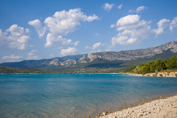 The Lac de Sainte-Croix surrounded by mountains in Europe, France, Provence Alpes Cote dAzur, Var, in summer, on a sunny day.