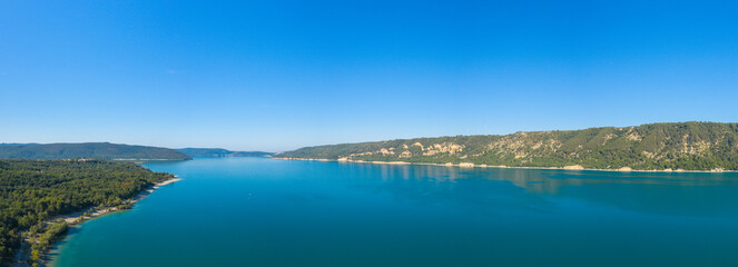 The panoramic view of Lac de Sainte-Croix and its countryside in Europe, France, Provence Alpes Cote dAzur, Var in the summer on a sunny day.