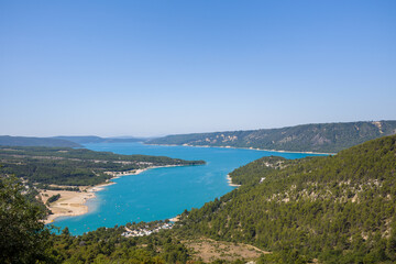 Fototapeta na wymiar The panoramic view of the Lac de Sainte-Croix and its green countryside in Europe, France, Provence Alpes Cote dAzur, Var in the summer on a sunny day.
