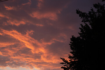 Beautiful orange-red clouds on sky during susnset