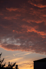 Beautiful orange-red clouds on sky during susnset