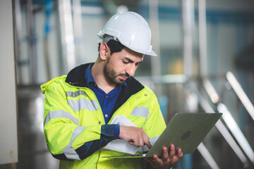 engineering worker manage working for control a production at industrial manufacturing plant