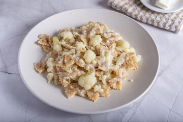 Pasta with cauliflower and goat cheese.