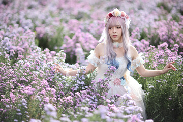Fototapeta premium Beautiful young woman with white lolita dress with flowers garden Japanese fashion