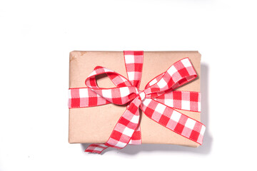 Christmas background with hand crafted gift boxes, fir tree branches and Christmas tree ball, white background copy space