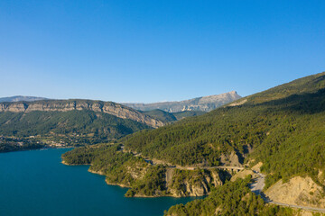 Fototapeta na wymiar The green banks of Lac de Castillon in Europe, France, Provence Alpes Cote dAzur, Var, in summer, on a sunny day.