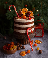 Christmas cake decorated with sweet nuts, marzipans. Christmas tree - 474937544