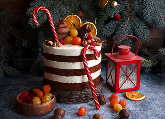 Christmas cake decorated with sweet nuts, marzipans. Christmas tree - 474937555