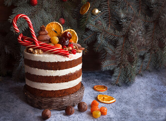 Christmas cake decorated with sweet nuts, marzipans. Copy Space - 474937570
