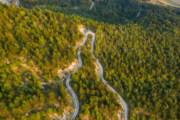 A road winds through the Gorges du Verdon amid mountains and forests in Europe, France, Provence...