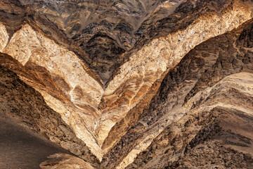 Abstract reddish colourful rocks and stones at Himalayan mountain range at Ladakh - painting look formation , mountains , ladakh landscape. Shot at Leh, Jammu & Kashmir, India