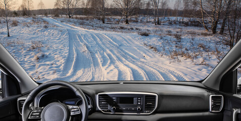 View of car on winter birch forest