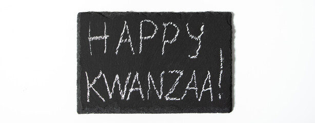 Happy Kwanzaa concept. Afro-American holiday. Congratulatory lettering on white background.