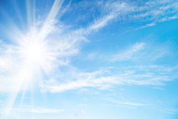 Naklejka na ściany i meble blue sky with light clouds and sunbeams