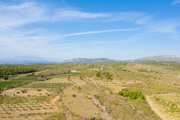 Fototapeta premium The village of Opoul Perillos surrounded by the many vineyards in Europe, France, Occitanie, the Pyrenees Orientales, in summer, on a sunny day.
