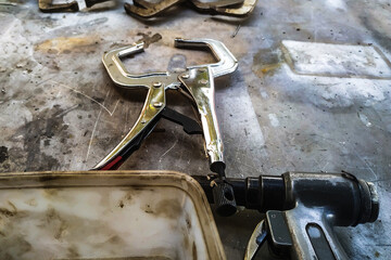 the workplace of a locksmith welder with different tools