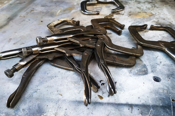 the workplace of a locksmith welder with different tools