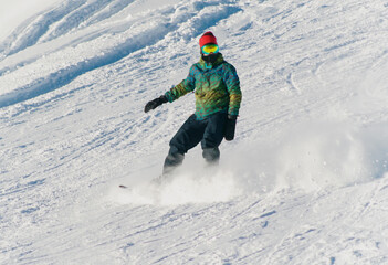 Fototapeta na wymiar Snowboarder on the snowy slope