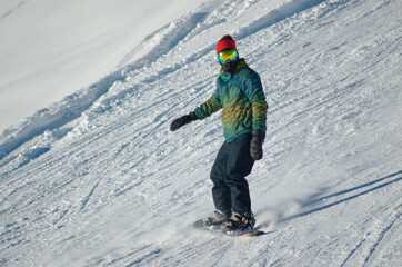 Fototapeta na wymiar Snowboarder on the snowy slope