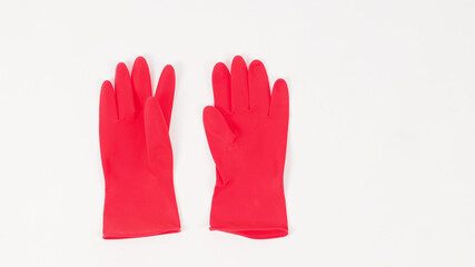 Red latex gloves isolated on white background.