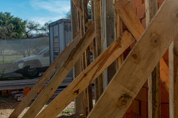 wood placed to support tile filling on the roof at construction site